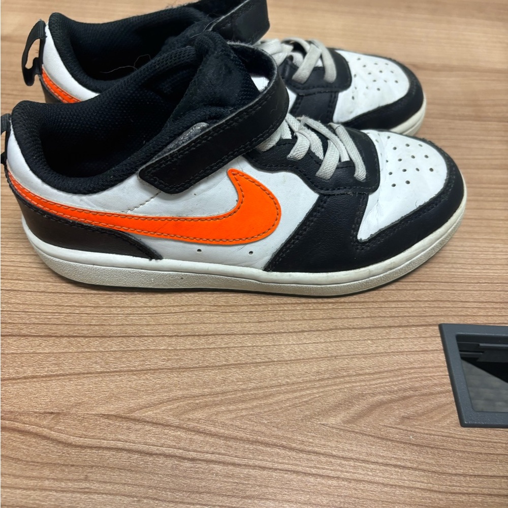 Kids Black and White Nike dunks Sneakers with Orange Accent